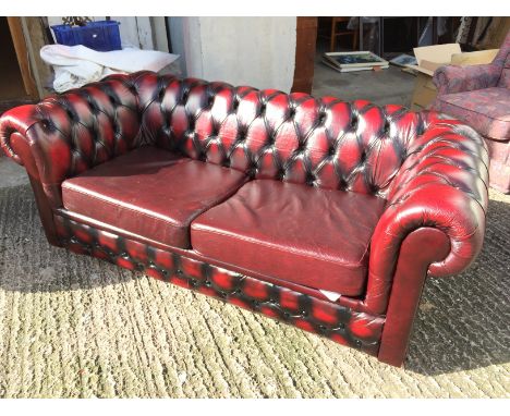 *A leather Chesterfield sofa bed.