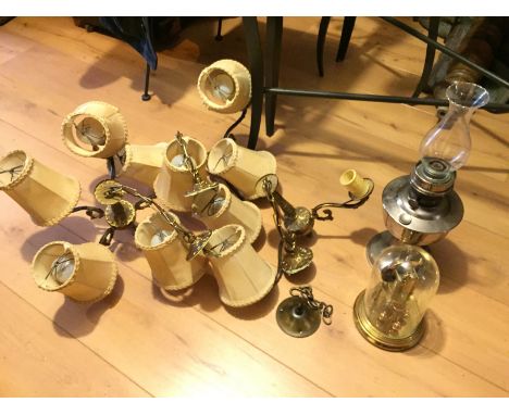 *An oil lamp a carriage clock and two light fittings.