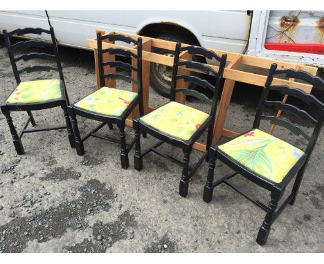 Four ladder back dining chairs