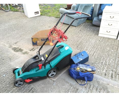 *An electric Bosch Rotak 34 lawn mower and a good selection of hand tools including a metal tool box.