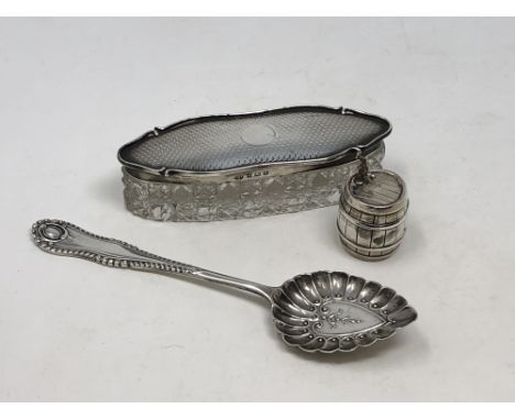 A silver and cut glass pot, a spoon and a miniature barrel with tap