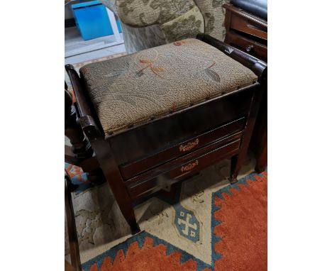 An Edwardian storage piano stool with music 