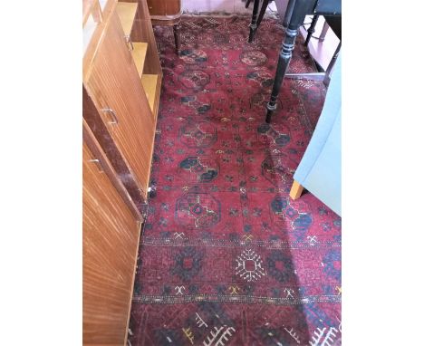 An antique Eastern carpet. 