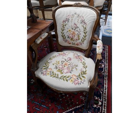 A carved walnut tapestry seated armchair 
