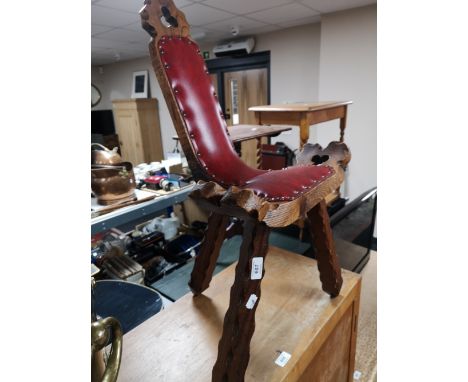 A carved wooden stool 