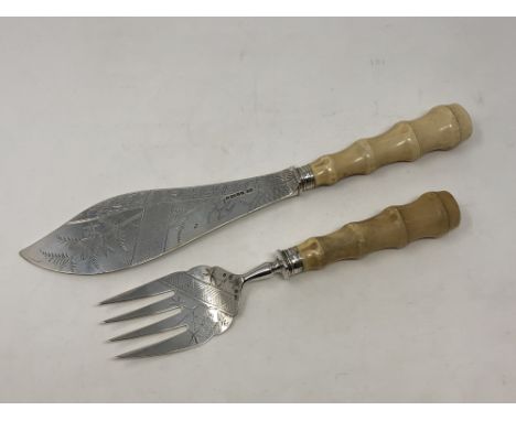 A fine pair of Victorian silver and ivory fish servers, Harrison &amp; Howson, Sheffield 1880, engraved with birds and butter