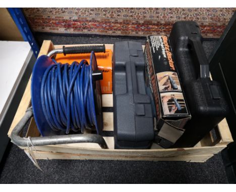 A crate of extension lead, paint stripper, black and decker tools etc 