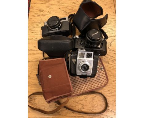 A Nikon EM camera, Kodak Brownie twin 20 camera and a Minolta Hi-Matic F camera (3)