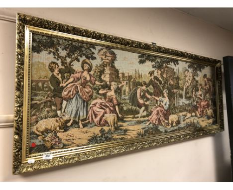 A gilt framed tapestry - lovers in a landscape 