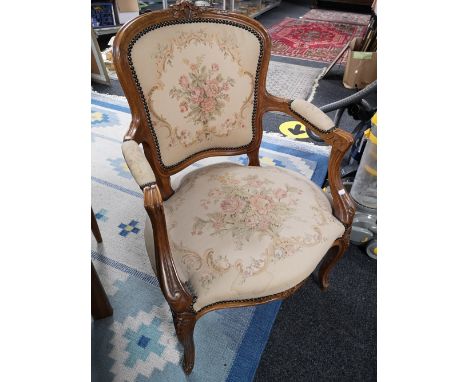 A carved walnut tapestry armchair 