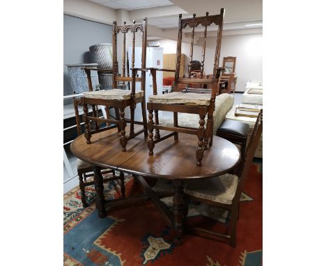 An Ercol extending table and four chairs 