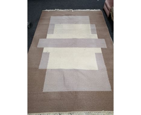 A contemporary carpet 310cm by 193cm