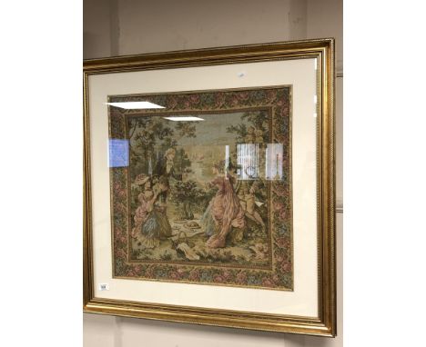 A  gilt framed tapestry - lovers in a garden 