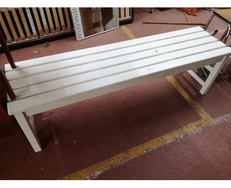 A painted pine wooden slatted bench. 