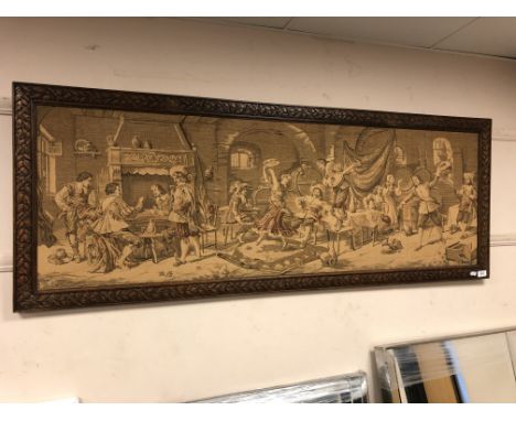 A carved oak framed tapestry depicting a tavern 