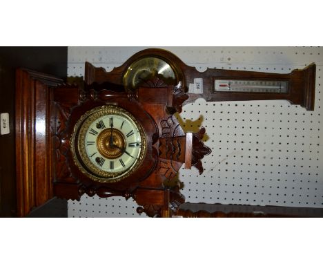 A late 19th century mantel clock, c.1890; an aneroid barometer (2)