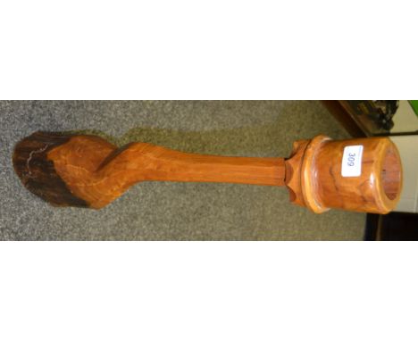 A contemporary floor standing candlestick made from a tree root
