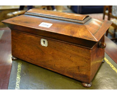 A Victorian mahogany sarcophagus shaped tea caddy c.1860