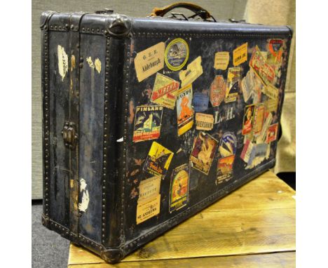A valet travel trunk with original interior fitting, labels applied to exterior