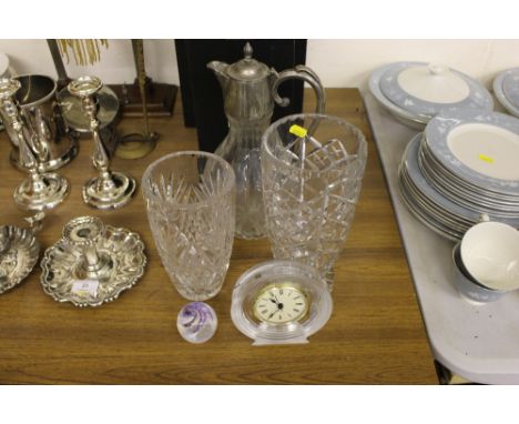 A Waterford crystal glass carafe together with two goblets, each in original boxes; two glass vases; a mantel clock; a Caithn