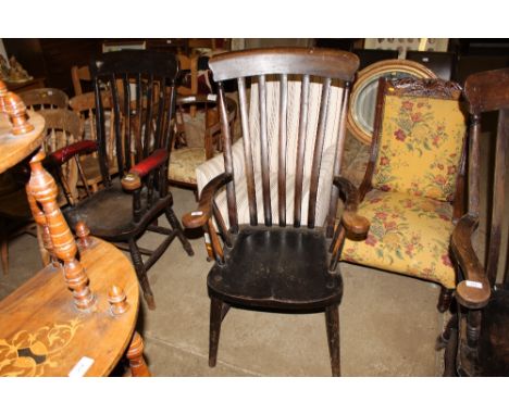 An elm seated stick back elbow chair