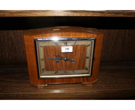 A 20th Century walnut cased two hole mantel clock