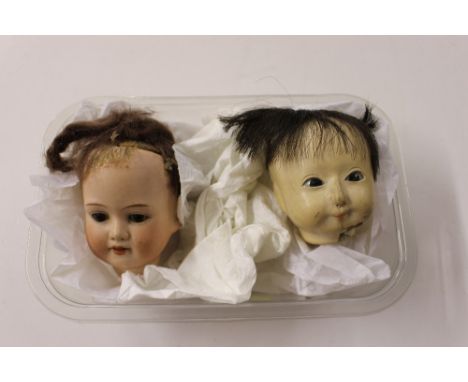 An Armand Marseilles bisque dolls head; and one other doll's head