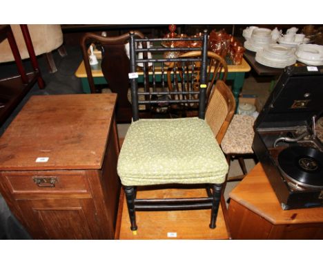 A child's late Victorian ebonised spindle back chair ; together with two stick and wheel back chairs; a cane back chair; and 