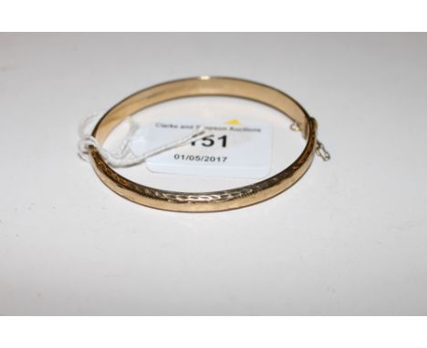 A 9ct gold bangle