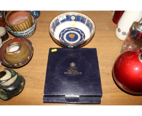 A Royal Worcester commemorative bowl; and two Royal Worcester plates