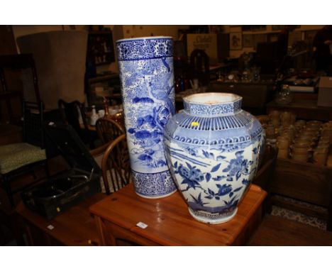 A blue and white ceramic stick stand  AF; together with a large blue and white vase  AF