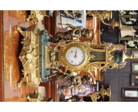 GERMAN ORMOLU CLOCK GARNITURE OF EIGHTEENTH CENTURY DESIGN
by Franz Hermle, Germany, the signed two train movement striking o