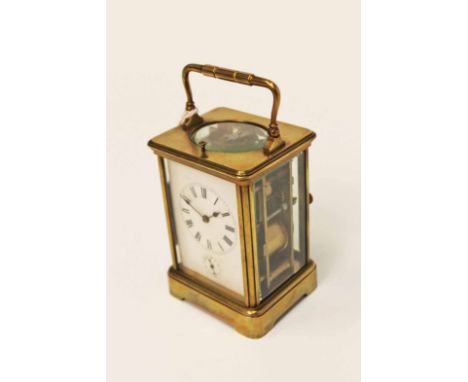 REPEATING BRASS CARRIAGE CLOCK
The two train eight day repeating movement striking on a gong and numbered 713, the white dial