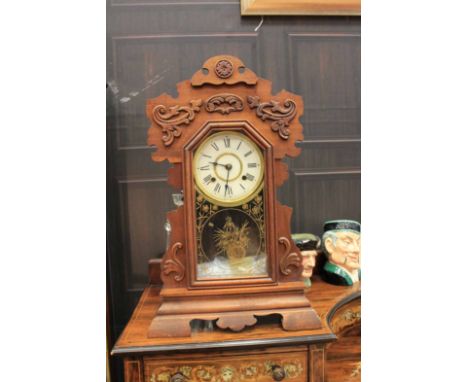 EARLY TWENTIETH CENTURY MANTEL CLOCK
The two train movement striking on a gong, the white dial with Roman numerals, blued ste