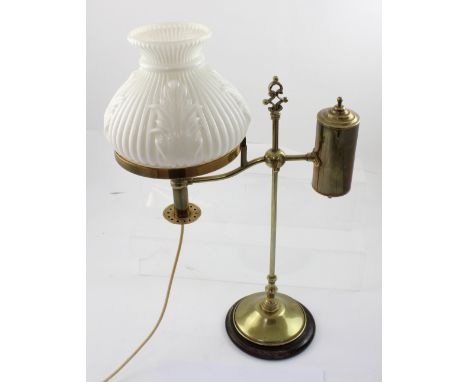 An early 20th century brass on wooden plinth gas table lamp converted to electricity, with milk glass moulded shade, height 5