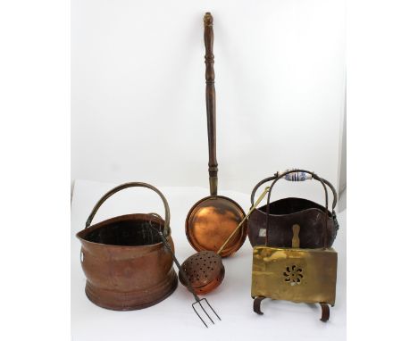 Two helmet-shaped copper coal scuttles, one with lead-glazed pottery handle, the other with brass swing arm, a chestnut roast