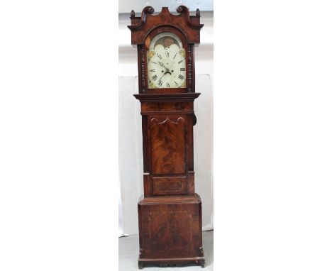 A late 18th/early 19th century mahogany eight-day longcase clock, broken swan neck pediment above moon phase, the white dial 