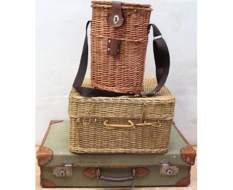 An early 20th century khaki canvas and brown leather-trimmed suitcase with hand-written name and number 'P.M. Dickin 125391',