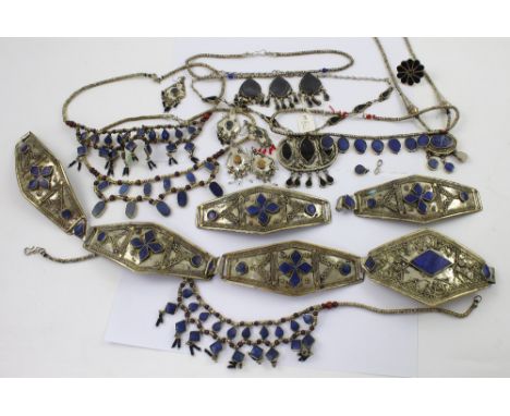 A quantity of white and yellow metal Afghan wedding and tribal jewellery to include a wide link belt set with lapis lazuli, a