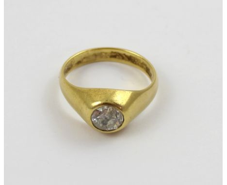 An 18ct gold gentlemen's dress ring set with a solitaire diamond, approx .75ct, size R1/2, approx 7.9g. CONDITION REPORT Hall