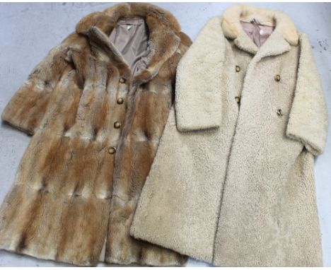 A three-quarter length rabbit fur coat with 'E J Kelly' label to the interior and a three-quarter length woollen coat with fu
