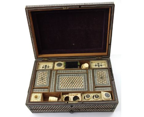 An Anglo-Indian bone and sandalwood mosaic sarcophagus casket, the fitted interior with thread bobbins, tape winder, inkwell,