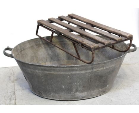 A vintage tin bath and an early 20th century children's sleigh (2).