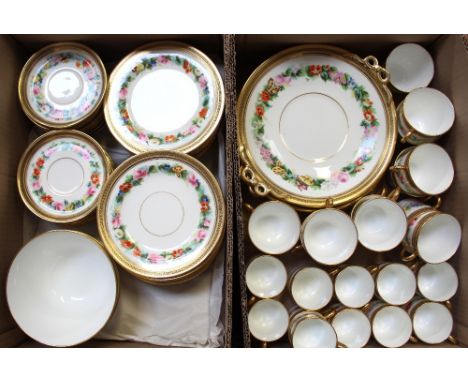 An early 20th century hand-painted part tea and coffee service with hand-painted floral bands to a white ground within a matt
