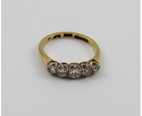 An 18ct gold ladies' ring set with five graduating size diamonds, size K, approx 2.7g.