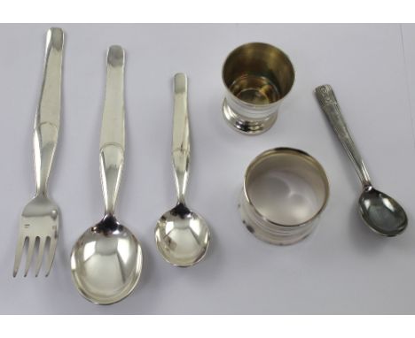 A cased French Orfevrerie Voglux crystal set of egg cup, napkin ring and teaspoon and a matching Christening set of spoon, te