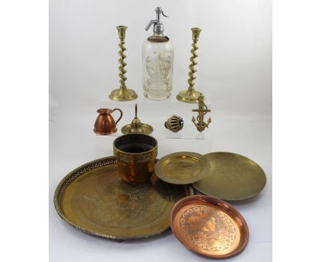 A small group of mixed metal items to include a pair of brass barleytwist candlesticks, a vintage glass soda siphon marked 'M