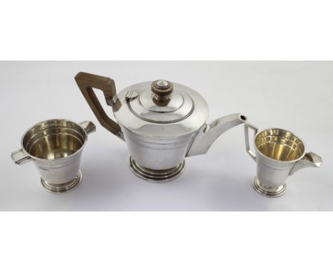 A George VI Art Deco three-piece tea service comprising teapot, milk jug and twin-handled sugar bowl, each of tapering conica