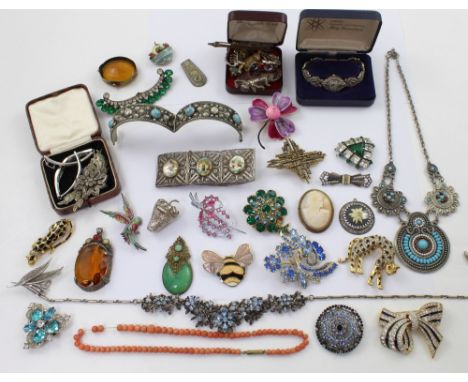 A quantity of vintage and contemporary  costume jewellery to include various panther brooches, diamanté brooches, Middle East