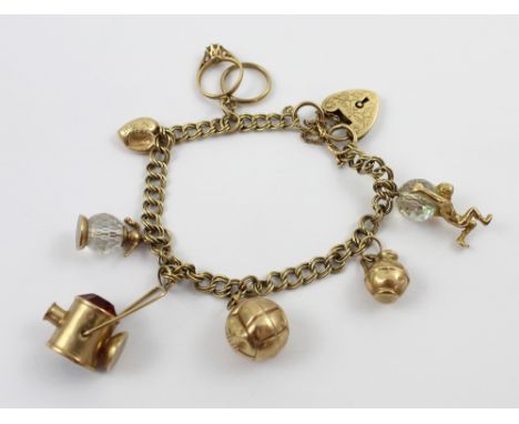 A 9ct gold link bracelet with eight charms to include a football, miners lamp, weeding and engagement ring etc, approx 24g.